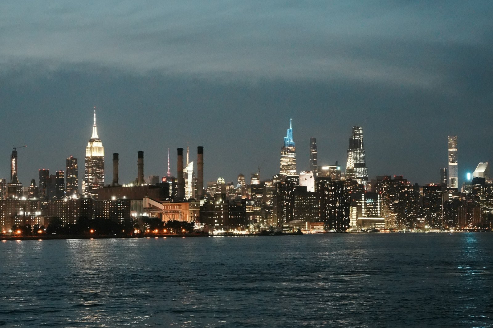 Vibes — Manhattan over the East River at night.