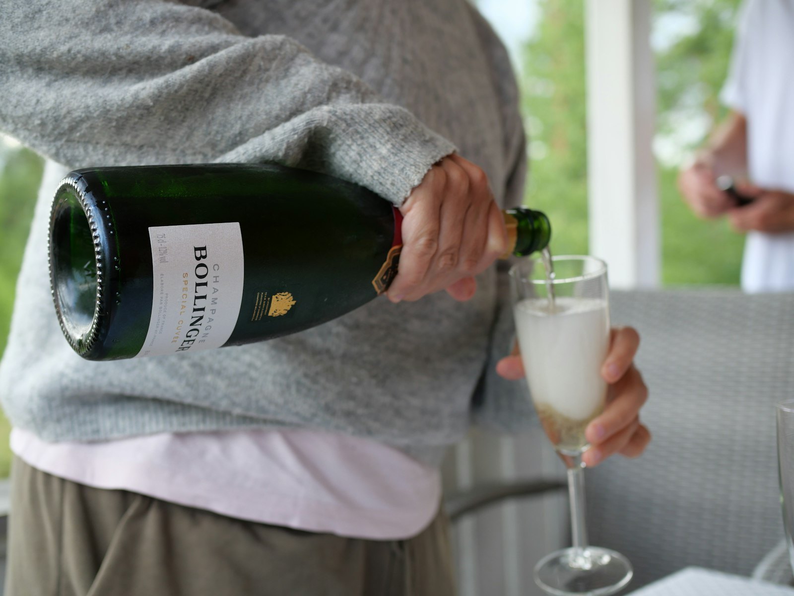 Partnerships & Sponsors — champagne poured at a table.
